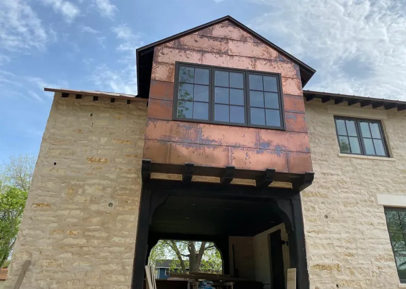 Copper metal panel facade on a stone building for Roof Repair in Kanab